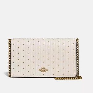 Callie Foldover Chain Clutch with quilting and rivets.